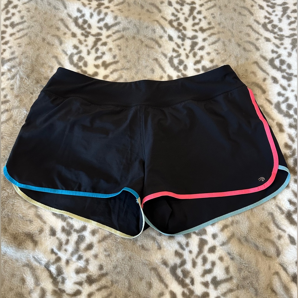 Solid black sport shorts with colored trim.